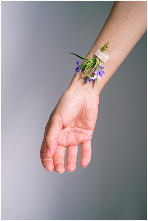 A unique conceptual image of a hand with flowers a