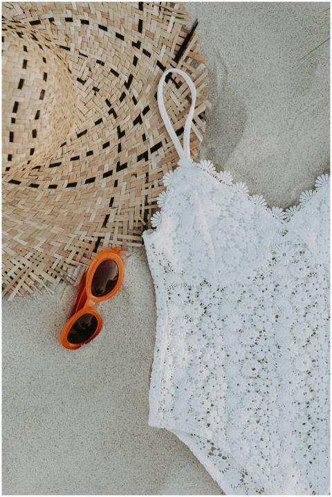 A laid-back summer vibe with a straw hat, lace swi