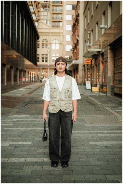 Stylish young adult posing confidently in a modern