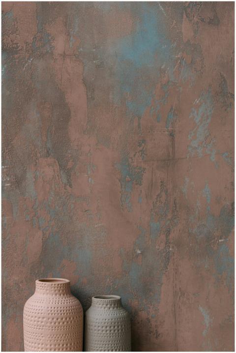 Minimalistic pottery vases placed against an artis