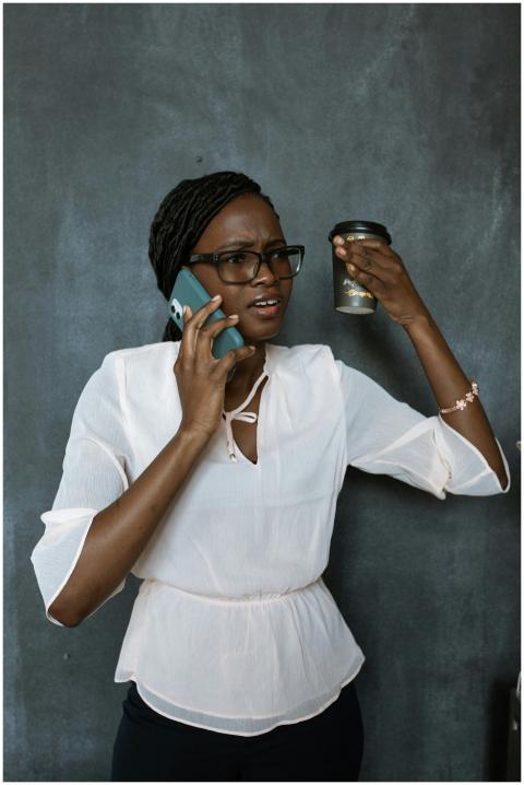 Businesswoman in a white blouse on a phone call, a