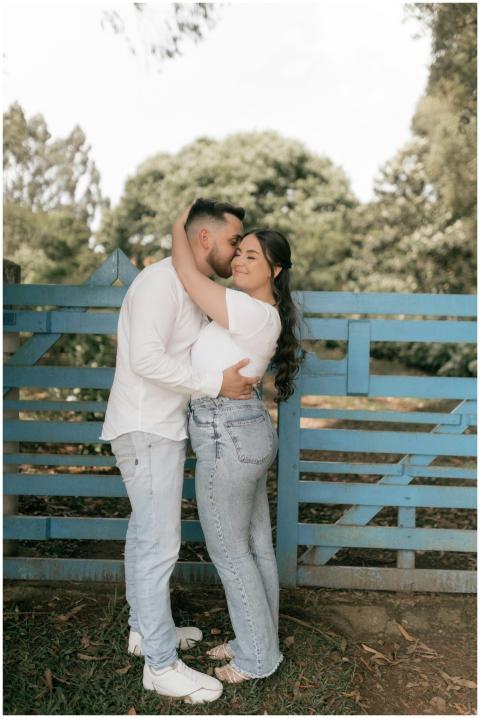 A couple in casual attire sharing a tender moment