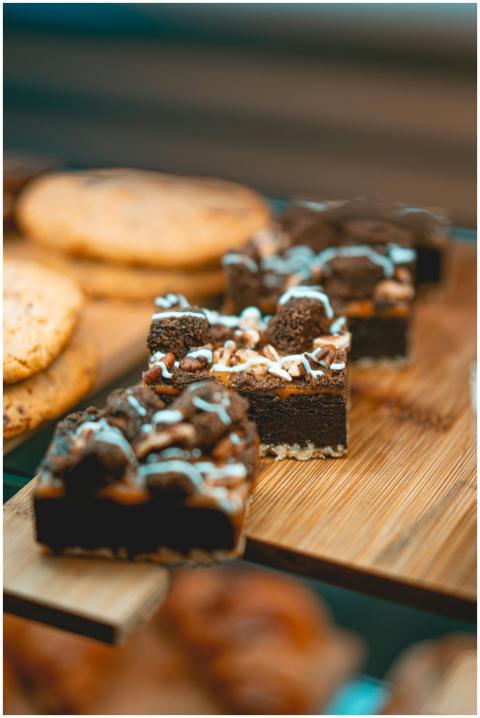 Close-up of chocolate brownies with icing on a woo