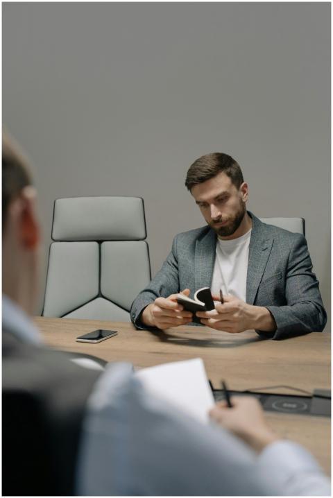 Professional meeting in office with two men, one t