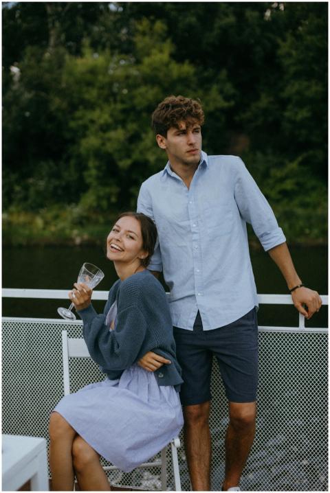 A young couple enjoys a summer day on a boat, feat