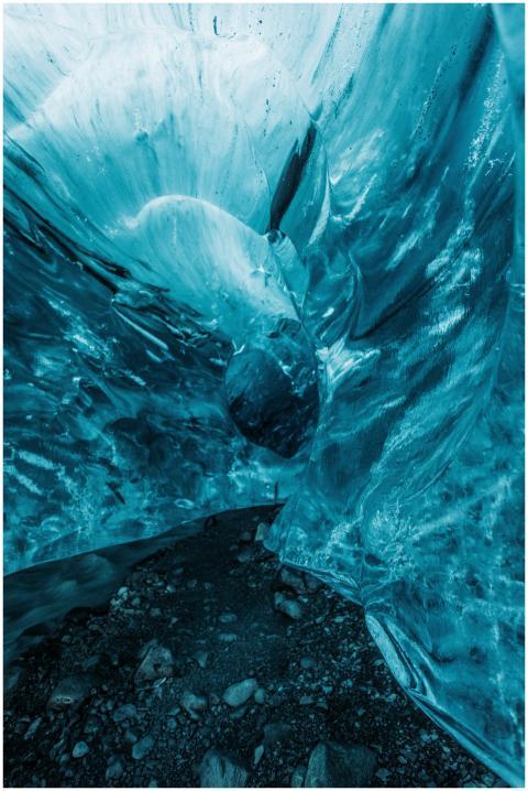 A mesmerizing view of frozen blue ice cave formati