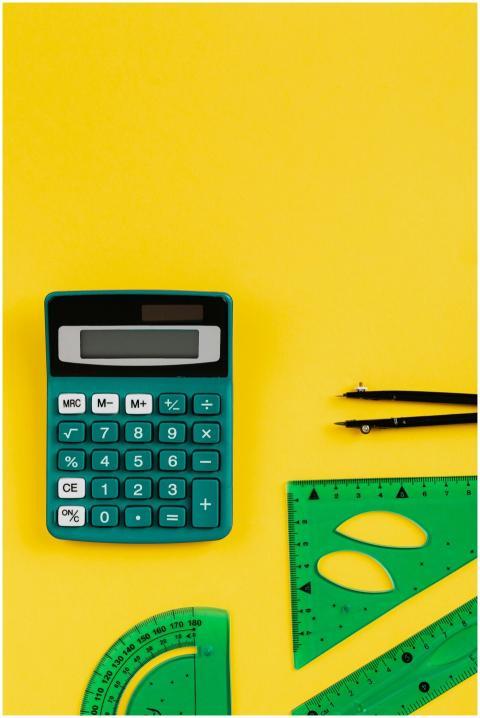 A teal calculator and green geometry tools on a vi