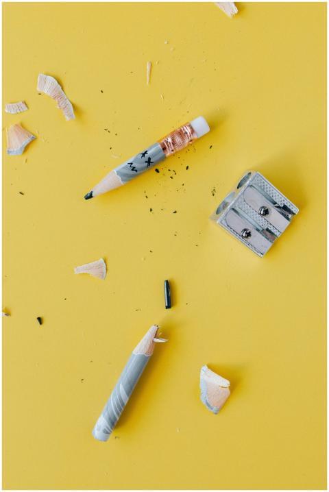 Close-up of pencils and sharpener with shavings on
