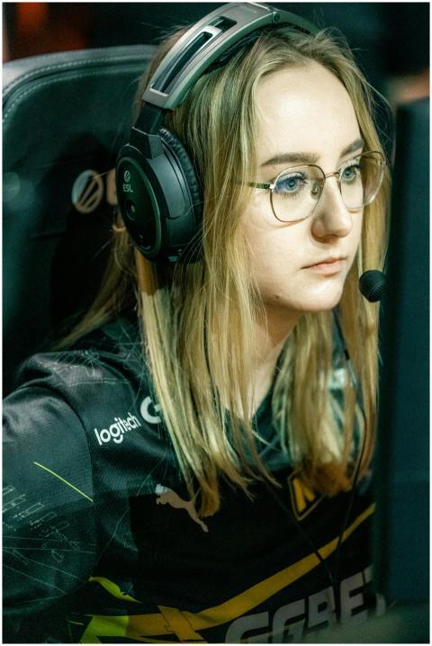 Young female esports player intensely focused duri