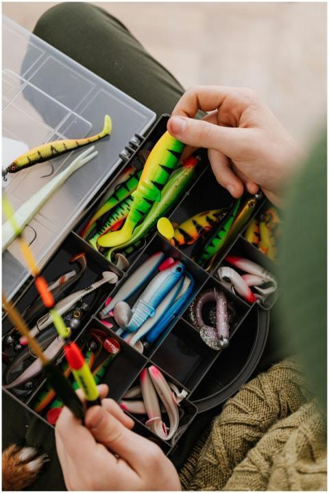 Bright fishing lures and equipment in an organized