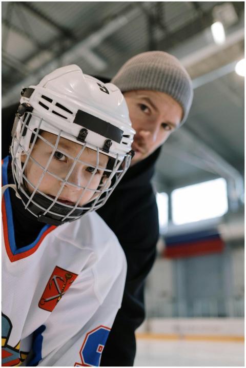 A father and son bond while practicing ice hockey