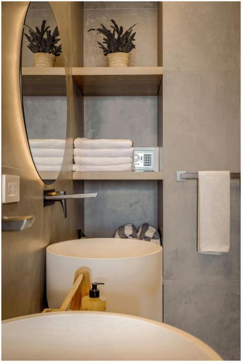 Minimalist bathroom with concrete walls and elegan