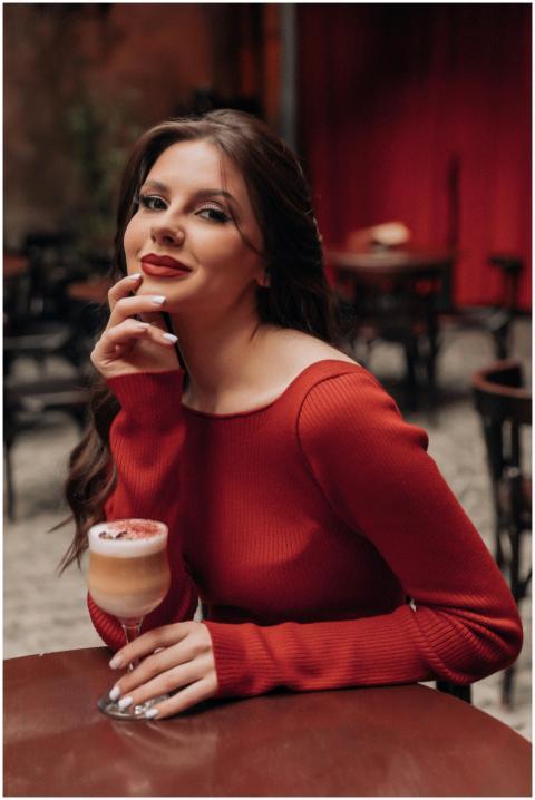 Sophisticated woman in red dress savoring dessert