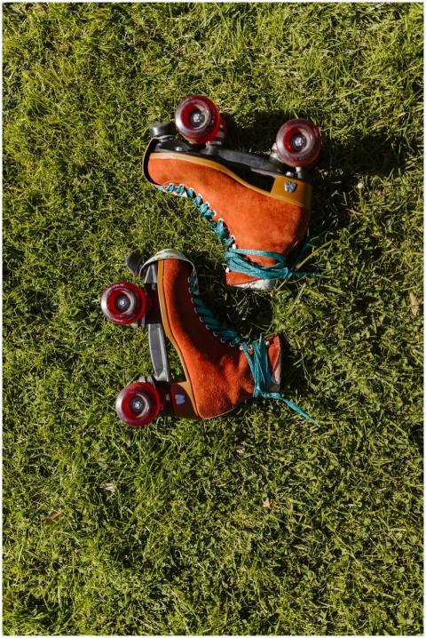 Colorful vintage roller skates placed on vibrant g