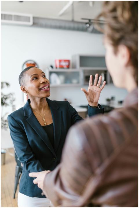 Businesswoman interacting enthusiastically in an o