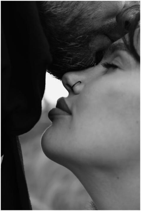 Close-up black and white portrait of a couple with