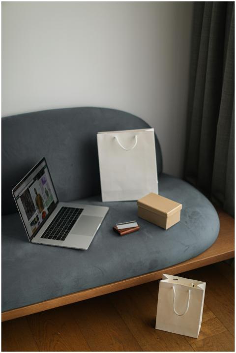 Contemporary e-commerce scene with laptop, shoppin