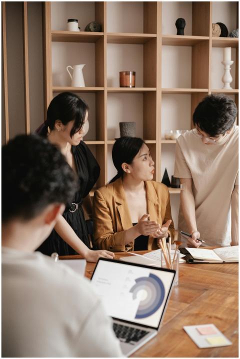 A group of professionals in a business meeting dis