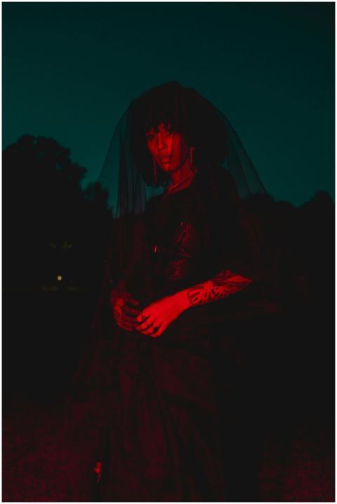 Artistic silhouette of a woman with red lighting a