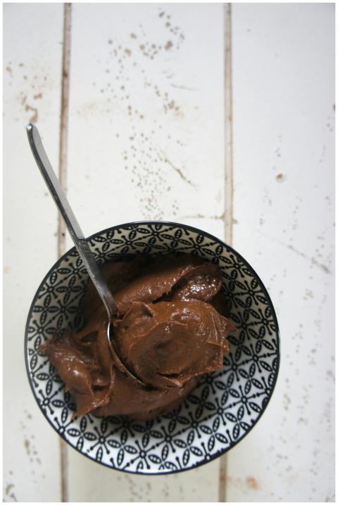 Spoonful of rich chocolate dessert in a patterned