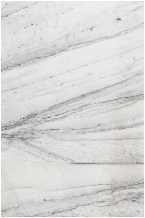 Close-up of a textured white marble surface with n