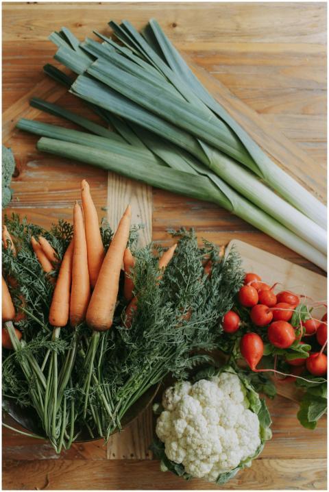 A variety of fresh vegetables including carrots, l