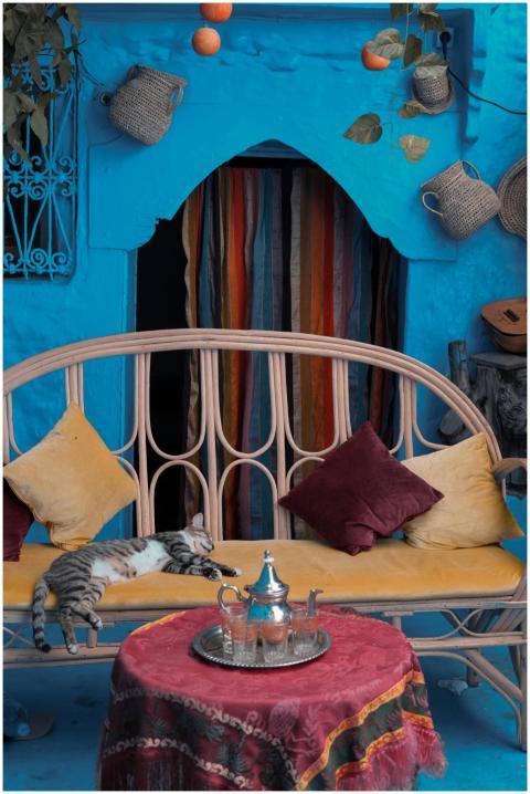 Colorful Moroccan patio scene featuring a relaxed