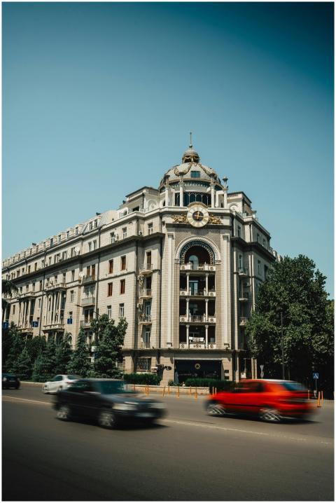 A classic urban building with cars in motion on a