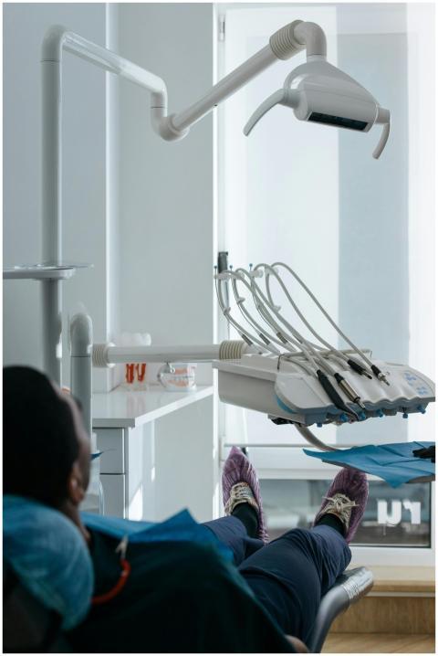 A patient seated in a dental chair at a modern den