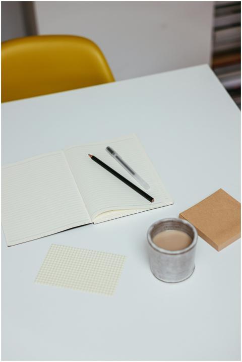 Minimalistic workspace setup with a notebook, penc