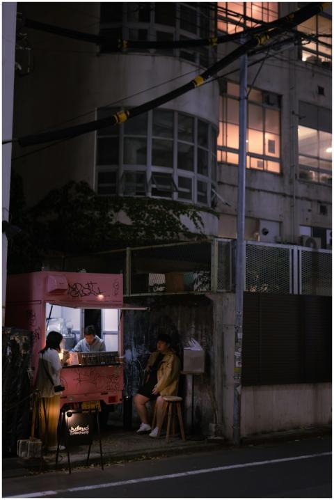 Nighttime shot of a street food stand in Tokyo, ca