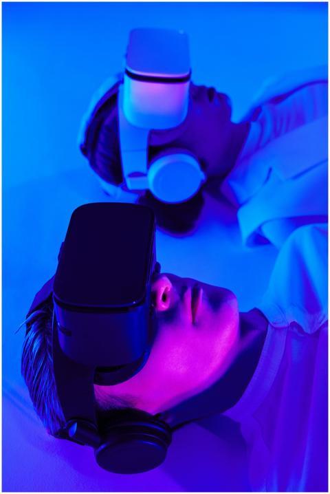 Close-up of people using VR headsets in vibrant st