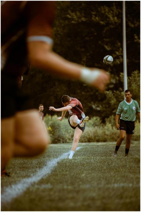 Athletes competing in an intense rugby match on a