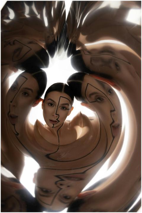 Creative portrait with surreal reflections, featur