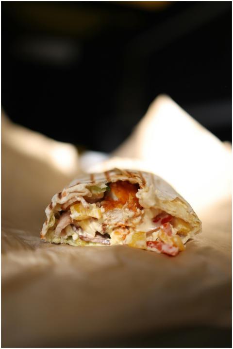 Delicious close-up of a fresh doner kebab with veg