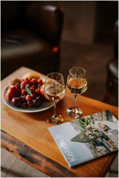 Elegant indoor scene with wine glasses and fruit,