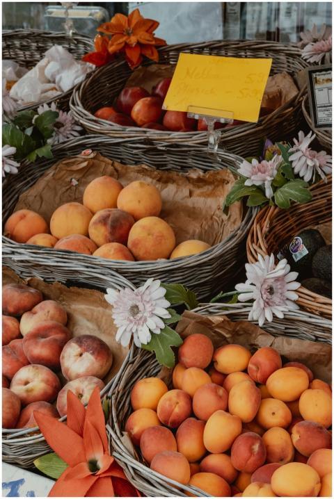 Colorful display of fresh peaches and apricots at