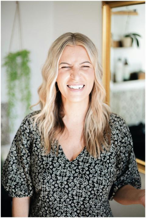 Candid portrait of a smiling woman with blonde hai