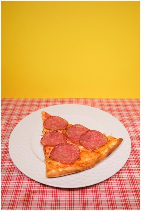 From above of slice of appetizing homemade pizza w