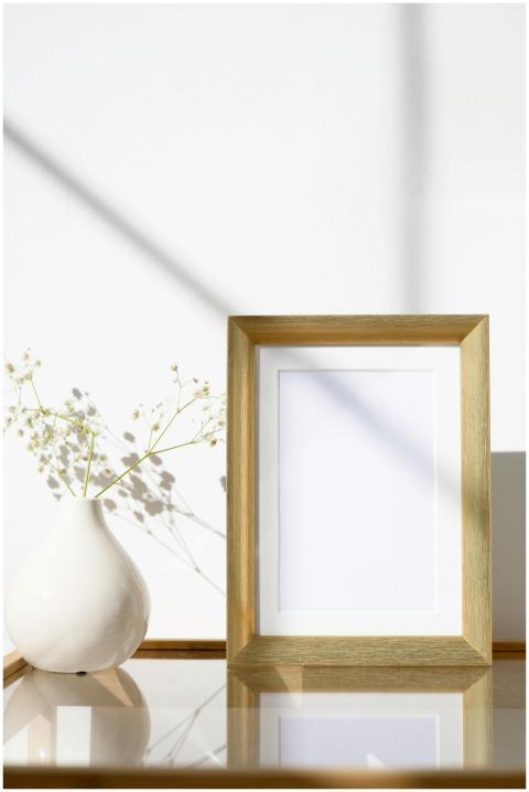 Elegant Scandinavian-style frame and vase setup fo