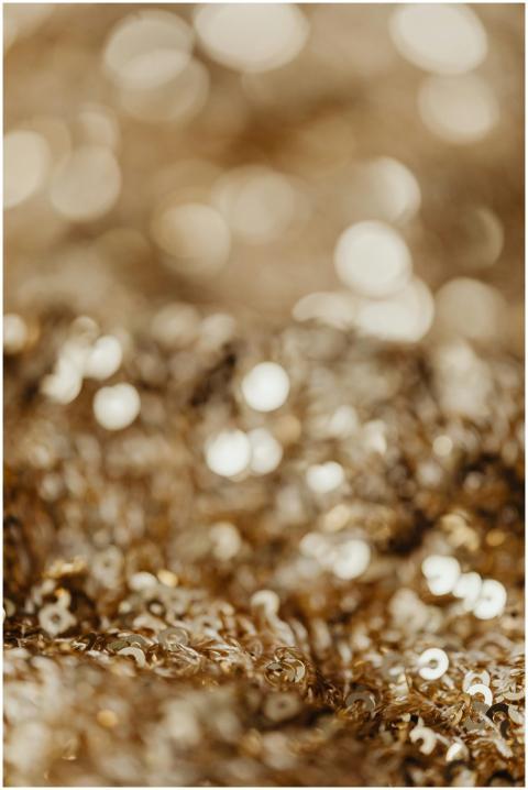 Close-up of shimmering gold sequins with a soft bo