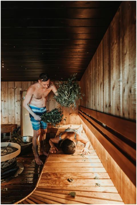 Two men engaging in a traditional Nordic sauna whi