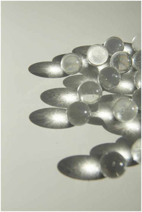 High angle of heap of small transparent glass ball