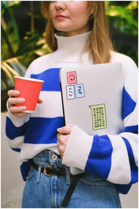 Fashionable woman in striped sweater holding a lap