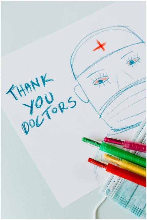 Colorful drawing thanking doctors with pencils and