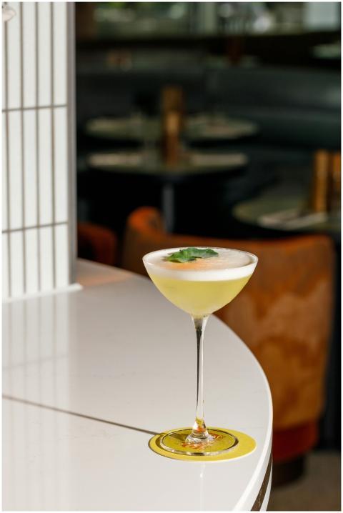 Stylish cocktail on a table in a chic Rome rooftop