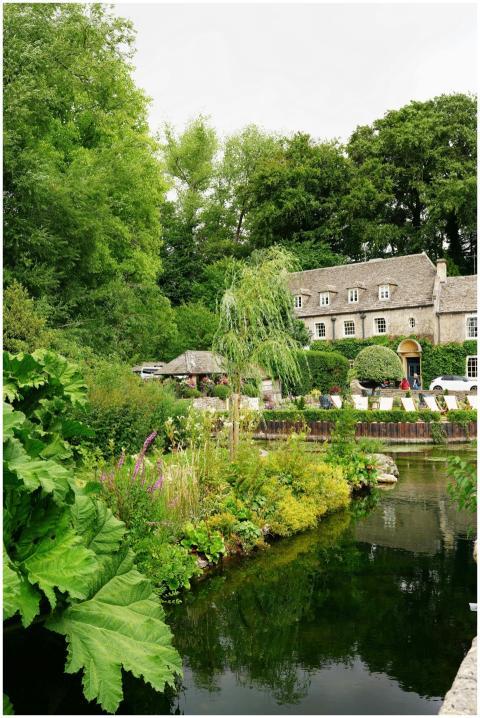 Beautiful stone cottage surrounded by lush greener