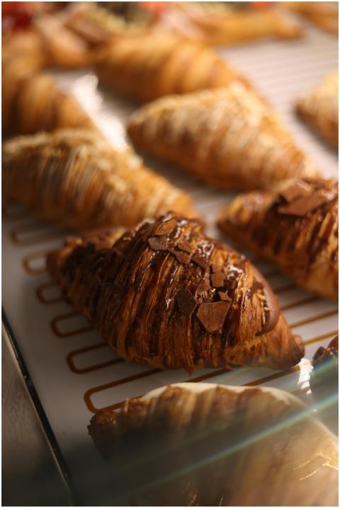 Freshly baked croissants topped with chocolate, ca