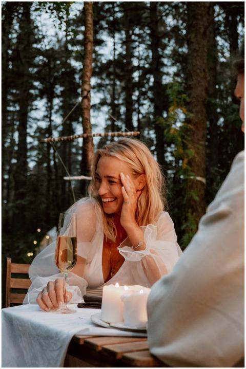 A woman enjoys a romantic outdoor dinner with cham