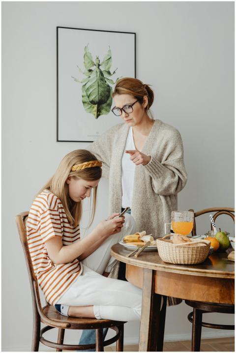 A mother and daughter in a serious conversation at